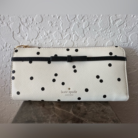 kate spade Handbags - Kate Spade polka dot wallet in white color.